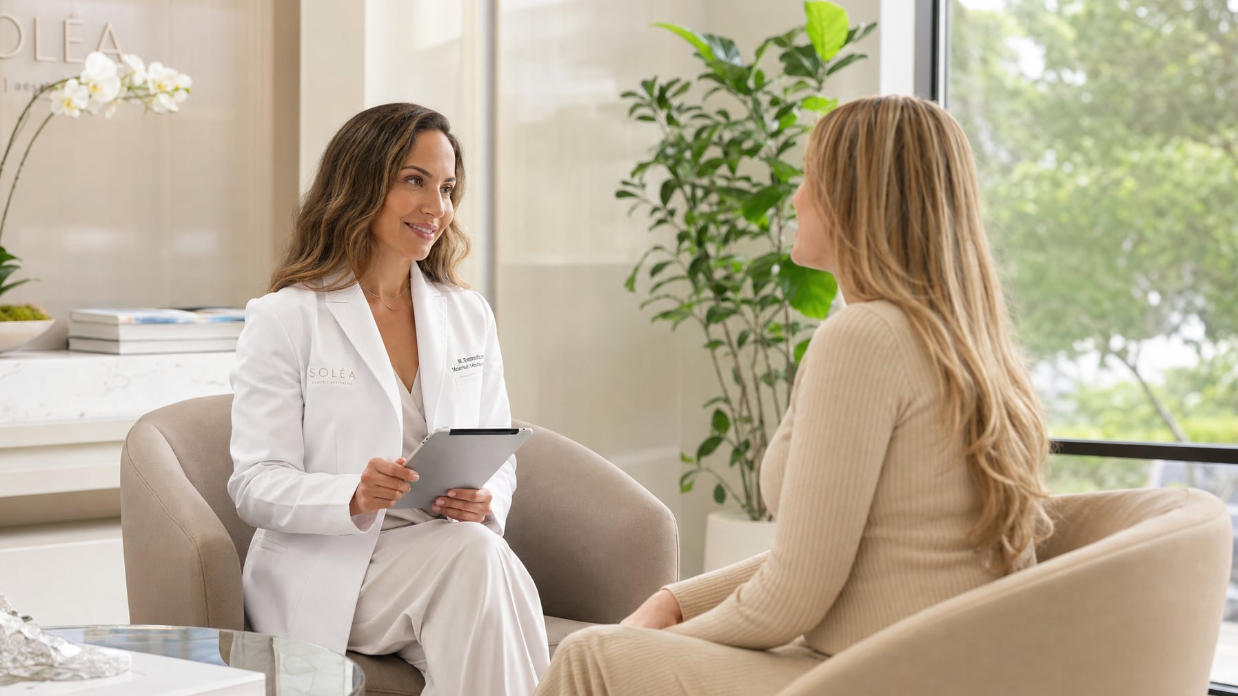 Practitioner consulting with a client in a bright wellness clinic
